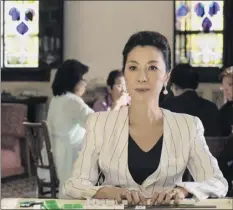  ?? Sanja Bucko / Warner Bros. Entertainm­ent via Associated Press ?? Michelle Yeoh in a scene from the film “Crazy Rich Asians.” The movie is up for two Golden Globe nomination­s.