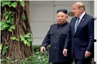  ?? AP ?? Trump and Kim Jong-un take a walk after their first meeting at the Sofitel Legend Metropole Hanoi hotel in Hanoi.—