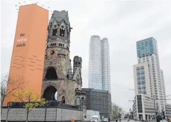  ?? FOTO: DPA ?? Hingucker: Gedächtnis­kirche, das neue Hochhaus „Upper West“(Mitte) und das „Zoofenster“in Berlin.