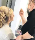  ??  ?? Picture perfect: Claire Thomson works on a bride to make sure she is all set to walk down the aisle