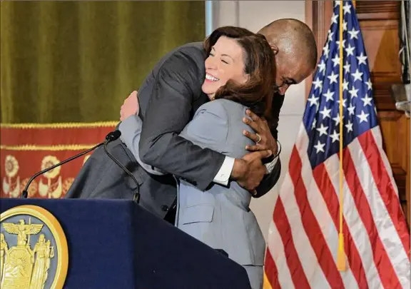  ?? Paul Buckowski / Times Union ?? U.S. Rep. Antonio Delgado hugs Gov. Kathy Hochul at a news conference Tuesday in Albany after Hochul announced that she is appointing Delgado lieutenant governor.