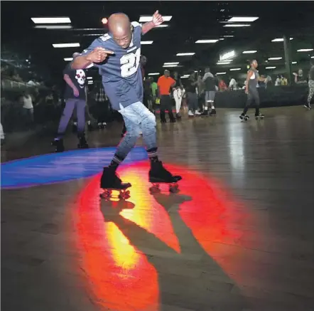  ?? Allen J. Schaben Los Angeles Times ?? SKATERS dance to music played by a DJ and mingle at World on Wheels in Mid-City. It reopened last month after four years.