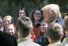  ?? Doug Mills/The New York Times ?? President Donald Trump speaks to boys and girls with the American Legion’s youth programs Wednesday in the Rose Garden at the White House. Mr. Trump’s declaratio­n that transgende­r individual­s would be barred from military service was met with surprise...