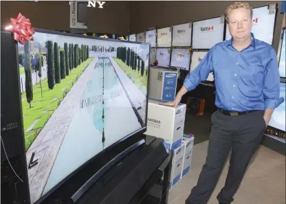  ?? GARY NYLANDER/The Daily Courier ?? LED high-definition big-screen TVs at deep discounts are the hot items for Black Friday, according to Derek Shaw, manager at Andre’s Electronic Expert’s on Springfiel­d Road. Andre’s has 26 outlets across British Columbia.