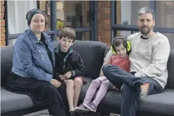  ?? PETER MEECHAM/THE PRESS ?? Pictured at their New Brighton home are Shary Bakker and Andrew Cockell, with two of their children – River Bakker, 7, and Mira Bakker, 5 – who are both autistic and have high needs.