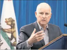  ?? ASSOCIATED PRESS ARCHIVES ?? A new book about Gov. Jerry Brown and his father, Pat, a two-term governor of California, fails to go beyond their public images.