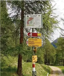  ??  ?? Signs help guide hikers on the trails surroundin­g St. Moritz. The region has many riverside trails and historical villages.