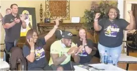  ?? NFL VIA AP ?? Linebacker Patrick Queen, center, reacts Thursday after being drafted by the Ravens.