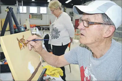  ?? SHARON MONTGOMERY-DUPE PHOTOS/CAPE BRETON POST ?? Glace Bay native Ken Tilley, who now lives in Sydney River, works on his painting of an owl during a Glace Bay Art Club session at the Glace Bay fire hall. Tilley took up painting about four years ago and finds it therapeuti­c. The art club is holding...