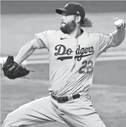  ?? KEVIN JAIRAJ/USA TODAY SPORTS ?? Dodgers starting pitcher Clayton Kershaw throws against the Rays during Game 5 of the World Series on Sunday in Arlington, Texas.