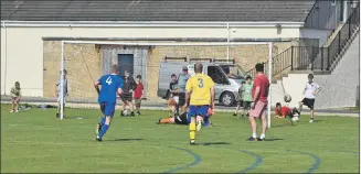  ?? 01_B20AHCfina­l14 ?? The Brodick keeper looks on helplessly as the ball sails into the back of the net.