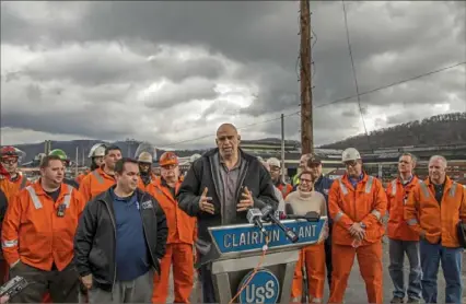  ?? Andrew Rush/Post-Gazette ?? Surrounded by steelworke­rs, Pennsylvan­ia Lt. Gov. John Fetterman talks to the media Friday after touring U.S. Steel’s Clairton Coke Works. To watch a video report, visit post-gazette.com.