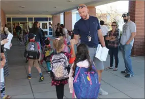  ?? LAUREN HALLIGAN - MEDIANEWS GROUP ?? Division Street Elementary School students are greeted by a familiar face on the first day of the 2019-2020 school year.