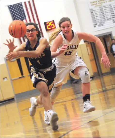  ?? Photos by Ernest A. Brown ?? St. Raphael junior forward Sierra Gonzalez (1, above) fires a pass with La Salle’s Catherine Medeiros in pursuit in the first half of the No. 1 Rams’ 52-45 victory over the No. 16 Saints in the first round of the Open tournament Wednesday night at...