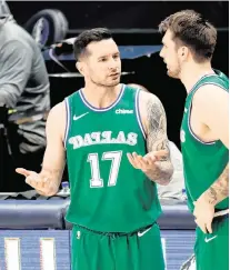  ?? KEVIN JAIRAJ Kevin Jairaj-USA TODAY Sports ?? Now an ESPN analyst, then-Dallas Mavericks guard JJ Redick speaks with Luka Doncic (right) during a 2021 game.