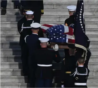  ?? TNS ?? HONOR GUARD: The casket of former President George H.W. Bush is carried into the U.S. Capitol on Monday.