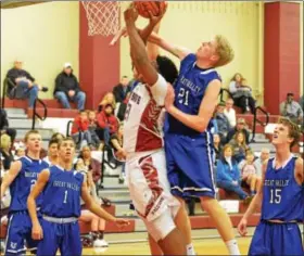  ?? THOMAS NASH - DIGITAL FIRST MEDIA ?? Pottsgrove’s Jason Hein rises up for a contested shot while Great Valley’s Liam Ward defends.