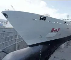  ?? THE CANADIAN PRESS FILES ?? The Resolve- Class naval support ship Asterix is unveiled at a ceremony at the Davie shipyard in Levis, Que., on July 20. Royal Canadian Navy sailors will begin training on the new ship in early January.