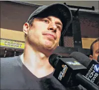  ?? AP PHOTO ?? Pittsburgh Penguins’ Sidney Crosby talks with media while cleaning out his locker at the NHL hockey team’s training facility in Cranberry, Pa., Wednesday.