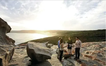  ??  ?? Natural beauty: snap your own postcard at remarkable rocks, a group of granite boulders perched atop a cliff that has been artistical­ly eroded by wind, sea and sand over time. — Tourism Australia