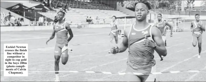  ?? ?? Ezekiel Newton crosses the finish line without a competitor in sight to cop gold in the boys 200m (photo compliment­s of Calvin Chapman).