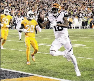  ?? GARY LANDERS / AP ?? Wide receiver A.J. Green scores the Bengals’ only touchdown on a 7-yard pass from Andy Dalton with 3:19 remaining in the first quarter. Green’s touchdown put the Bengals ahead for good.