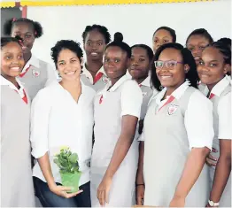  ??  ?? Marketing manager of beverages at LASCO Distributo­rs, Catherine Goodall (second left), and grade-nine students of The Queen’s School flash bright smiles.