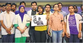  ??  ?? Members of Indian Medical Associatio­n, Maharashtr­a, protest at JVPD in Juhu, on Wednesday.