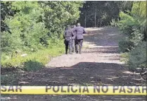  ??  ?? Víctima. El cuerpo estaba bocabajo y tenía varios disparos de pistola calibre 9 milímetros.