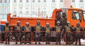  ?? AP PHOTO/DMITRI LOVETSKY ?? Russian Rosguardia (National Guard) soldiers stand blocking enter to the Palace Square a day before Sunday’s protest in St. Petersburg, Russia.