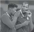  ?? RVR PHOTOS/ USA TODAY SPORTS ?? Jimmy Butler, left, and Kevin Durant celebrate the USA’s men’s basketball gold.