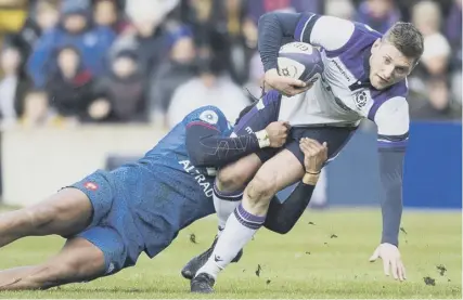  ??  ?? 0 Finn Russell, tackled by France’s Teddy Thomas on Saturday, is likely to start again against England.