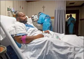  ??  ?? Cedric Daniels, 37, of Gonzales, La., rests in his room Aug. 2, recovering from covid-19 at Our Lady of the Lake Regional Medical Center in Baton Rouge.
(AP/Ted Jackson)