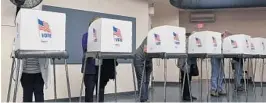  ?? RICKY CARIOTI/THE WASHINGTON POST ?? Voters cast their votes during early voting in Frederick, Md.