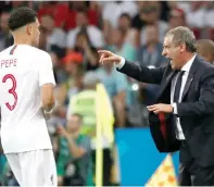  ?? Reuters ?? Portugal coach Fernando Santos gestures while Portugal’s Pepe looks on during the match against Uruguay. —