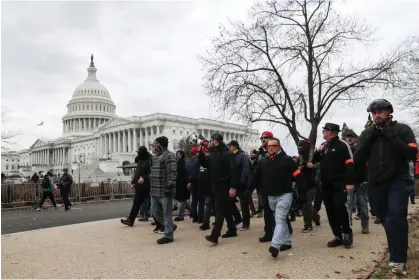  ?? Photograph: Leah Millis/Reuters ?? Members of the the far-right group Proud Boys march to the US Capitol building in Washington DC on 6 January 2021.