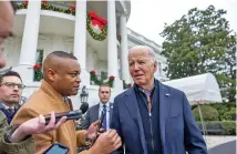  ?? TASOS KATOPODIS/GETTY IMAGES/TNS ?? U.S. President Joe Biden talks to the media Dec. 23 before boarding Marine One on the south lawn of the White House in Washington.