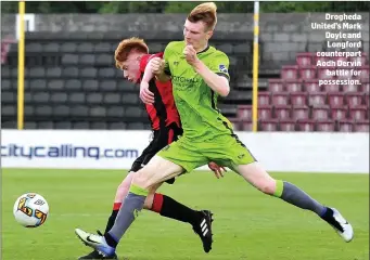  ??  ?? Drogheda United’s Mark Doyle and Longford counterpar­t Aodh Dervin battle for possession.