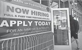  ?? ELISE AMENDOLA/AP ?? The strong jobs report could complicate President Joe Biden’s struggle to push through his $1.9 trillion COVID-19 relief package, though Senate approval was expected this weekend.