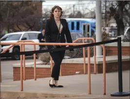  ?? GABRIELA CAMPOS — SANTA FE NEW MEXICAN VIA AP ?? Hannah Gutierrez-Reed arrives at the First Judicial District Courthouse in Santa Fe, N.M., on Wednesday for the start of her trial on charges of involuntar­y manslaught­er and tampering with evidence.