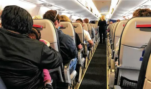  ?? Joe Amarante / Hearst Connecticu­t Media ?? The days of empty airports and planes may be over. Flight attendants’ advice: Exercise safety protocols, patience and kindness.