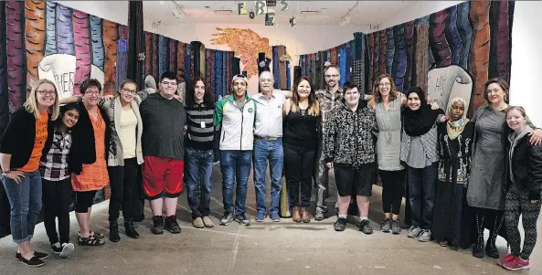  ?? PHOTOS: TROY FLEECE ?? Deaf and hard of hearing students at Thom Collegiate gather with teachers and artists at the Dunlop Art Gallery, which is featuring an exhibit of their work.