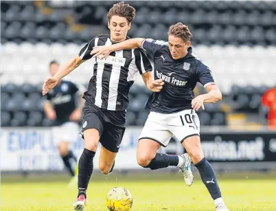  ?? Picture: SNS. ?? Relishing the challenge: Dundee’s Scott Allan, seen closing down Kyle Magennis, was a standout performer in the Dark Blues’ win against St Mirren on Tuesday.