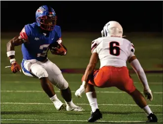  ?? PHOTO BY ROBERT CASILLAS ?? Serra running back Cincere Rhaney looks to get past Chaminade defensive back Miles Wilson during Friday night's Mission League opener. The host Cavaliers won 34-7to improve to 4-2overall.