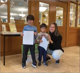  ?? COURTESY OF GROWING PLACES ?? A local family took part in the Growing Places Arbor Day event at the Leominster Public Library on April 29.