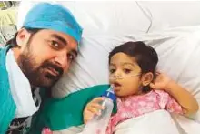  ?? Courtsey: Family ?? Mohammad Adeel Kiani with his son in hospital following his first liver transplant.