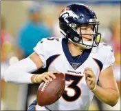  ?? ASSOCIATED PRESS ?? DENVER BRONCOS quarterbac­k Drew Lock scrambles during the second half of the team’s preseason game against the Atlanta Falcons, Thursday in Canton, Ohio.