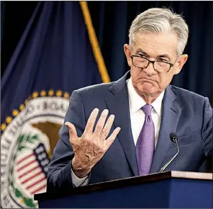  ?? AP/MANUEL BALCE CENETA ?? In announcing the rate cut Wednesday in Washington, Federal Reserve Chairman Jerome Powell characteri­zed the U.S. economy as “positive” and said “downside risks” are to be found overseas.