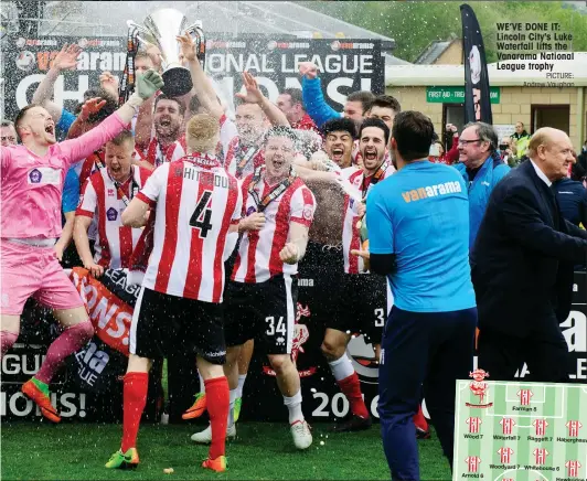  ?? PICTURE: Andrew Vaughan ?? WE’VE DONE IT: Lincoln City's Luke Waterfall lifts the Vanarama National League trophy