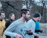  ?? ASHLEY GILBERTSON THE NEW YORK TIMES ?? United Nations representa­tives, including Canada’s Richard Arbeiter, centre, jog in Central Park.